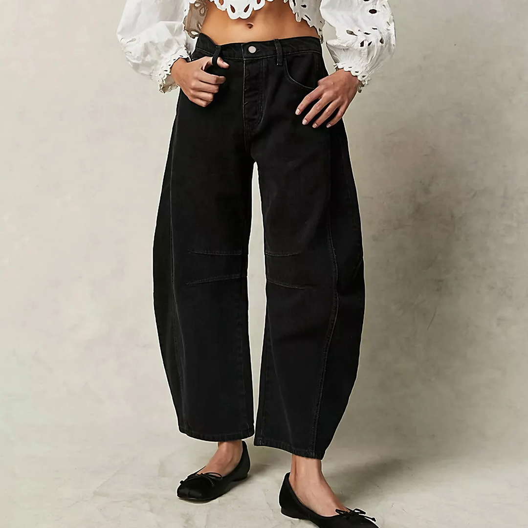 Black wide leg jeans from the Dylan Archer women’s premium clothing collection, defined by an elegant chic style and a clean, relaxed silhouette.