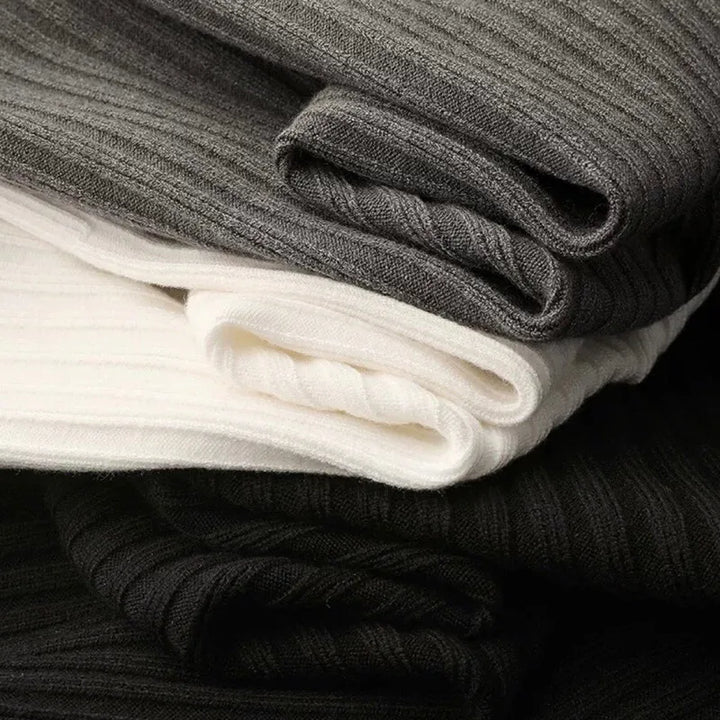 White, Black and Grey quarter zip knit sweaters with a structured vertical rib design from the Dylan Archer men’s premium clothing collection, defined by an elegant chic style and a clean, refined silhouette.