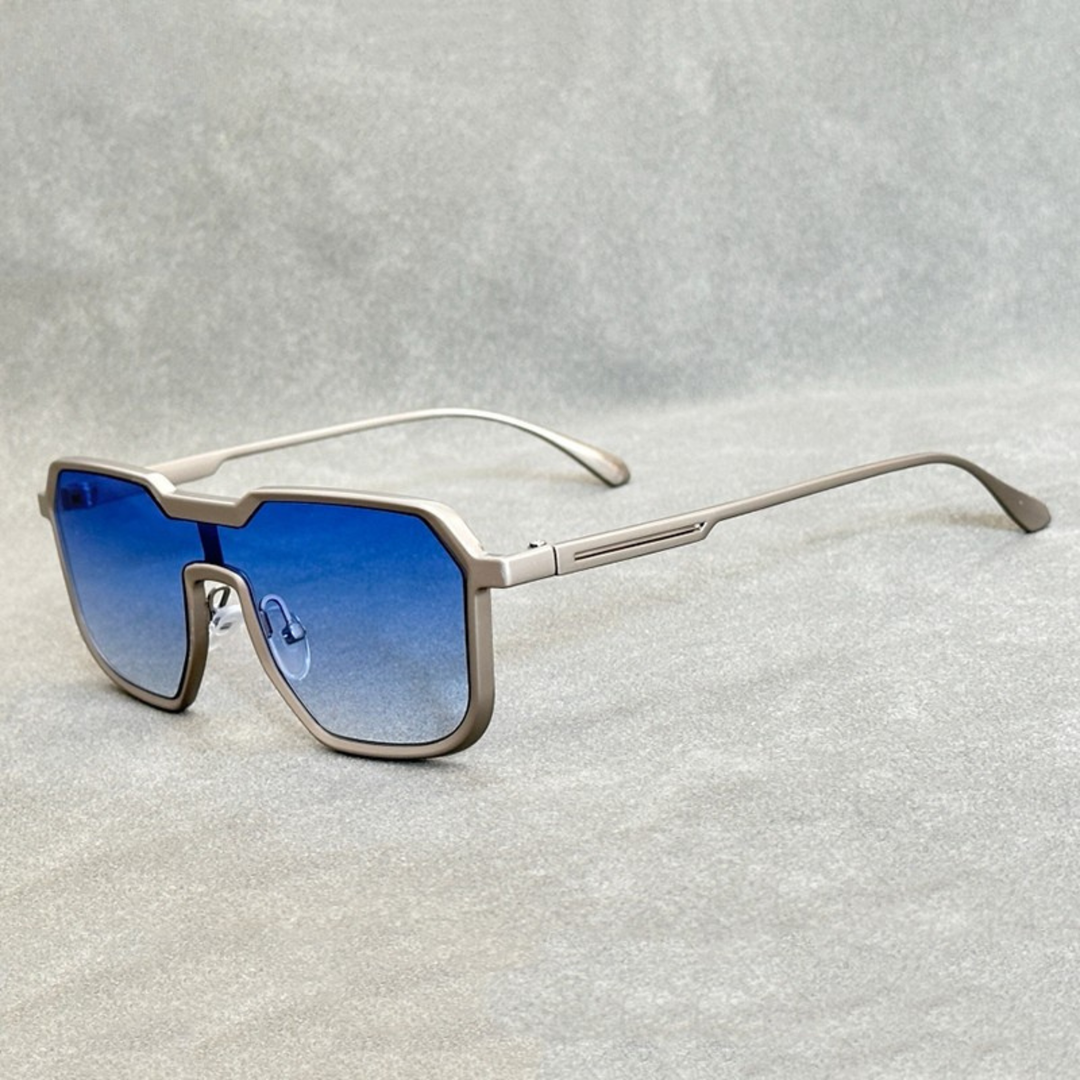 Silver titanium sunglasses with blue gradient lenses from the Dylan Archer Shades collection, defined by an elegant chic style and a clean, modern silhouette.
