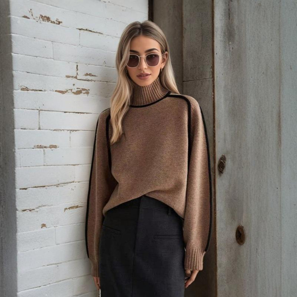White women wearing a Brown refined knit turtleneck sweater from the Dylan Archer women’s premium clothing collection, styled in an elegant chic style with tailored trousers in a clean studio setting.